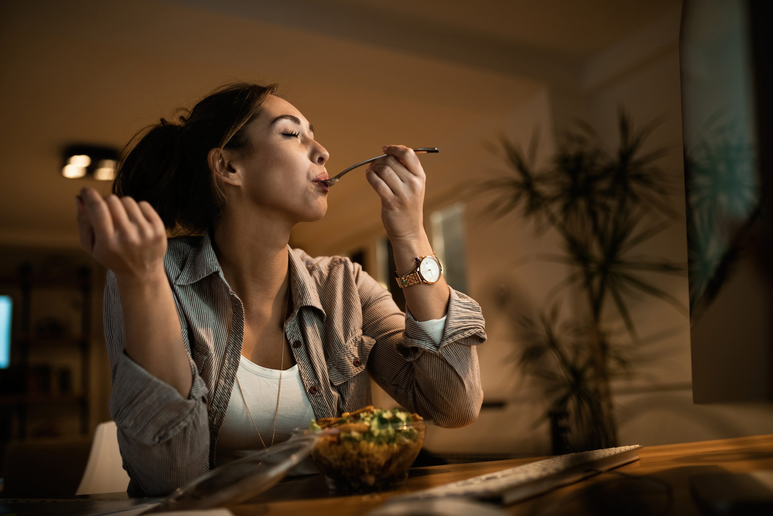 low angle view young woman eating salad scaled